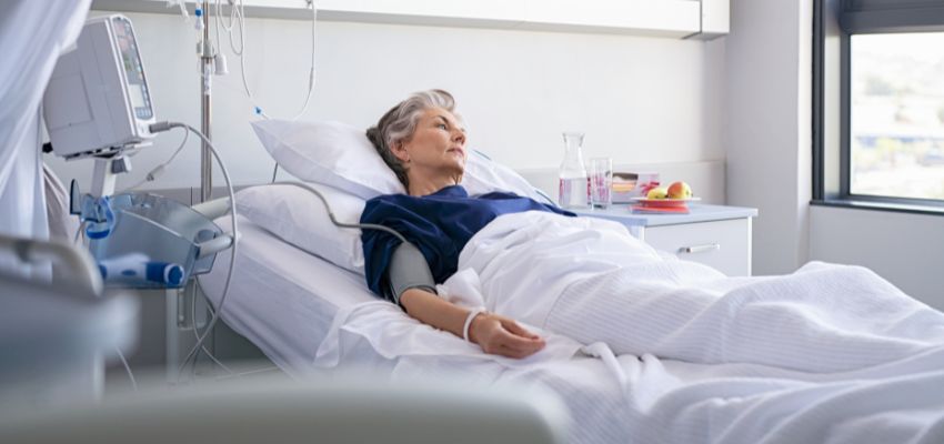 The patient constantly changes her position to prevent pressure ulcers.