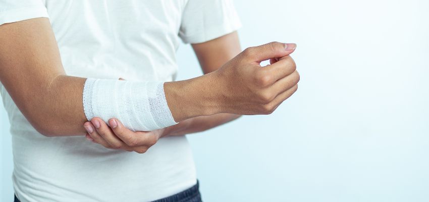 The man wrapped the stitches on his arm to avoid infection.