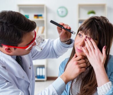 The doctor checks why the woman has dry eyes.