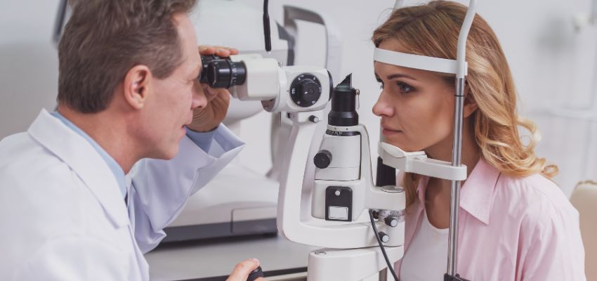 The doctor examines the eyes of patients who seem to need new corneas.