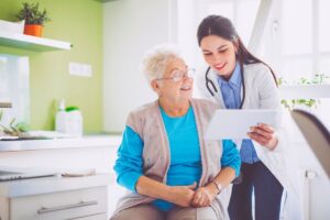 The doctor is happy to inform his patient that they have successfully healed the patient's non-healing wounds.