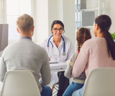 The doctor happily discusses the benefits of regenerative medicine with the family.