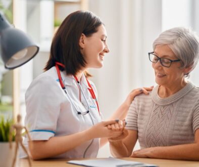 The doctor happily discusses how regenerative medicine treatment can help the older woman.